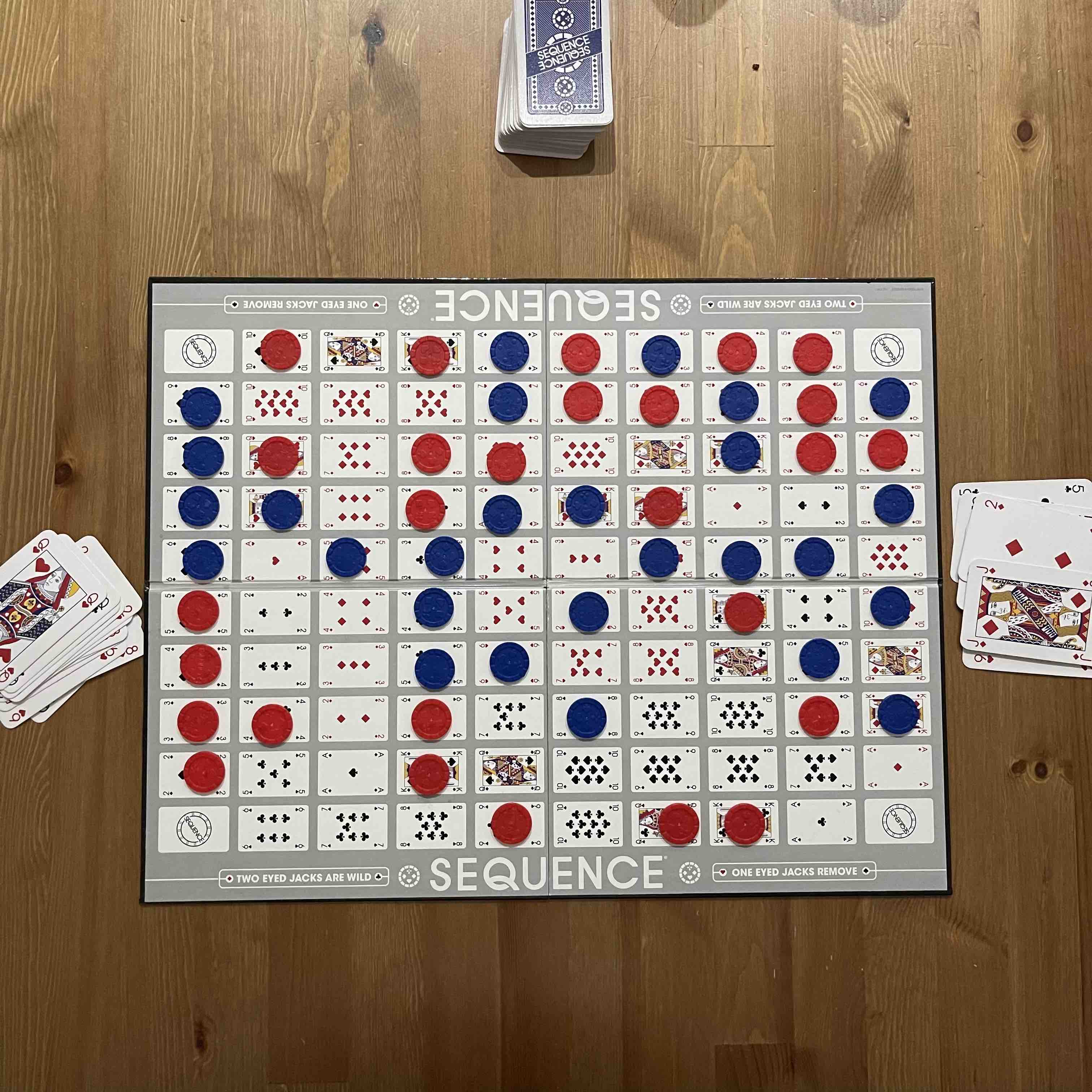 Aftermatch shot of a Sequence (game) board with red and blue chips placed on top where the blue team won.